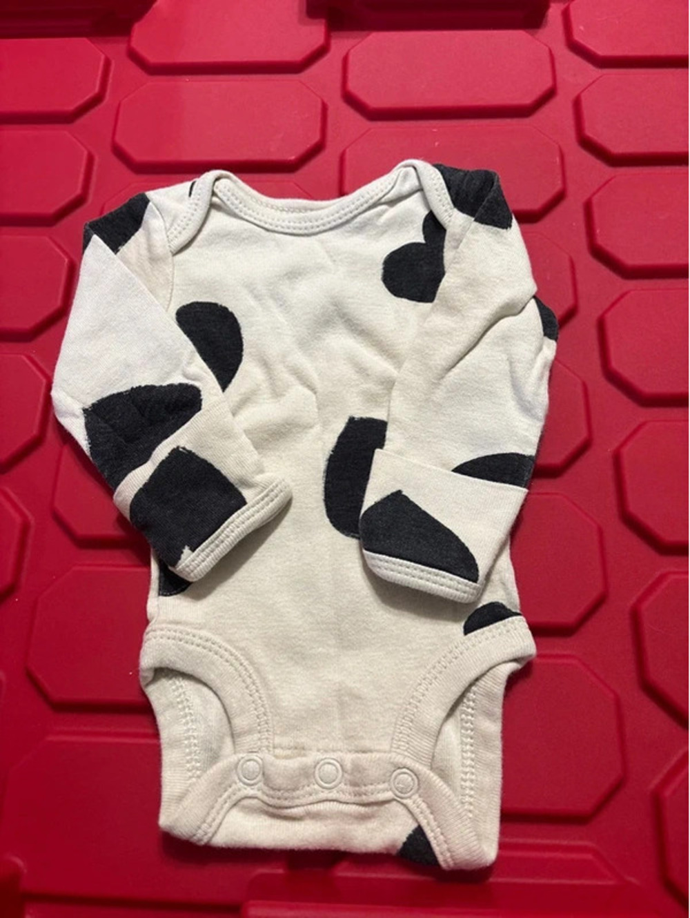 Premie onsie with black hearts/cream colored